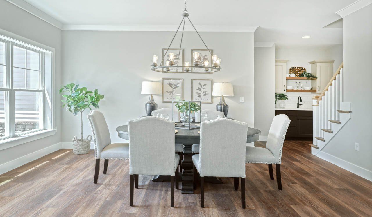 Dining room with chandelier in new home by Landmark Homes
