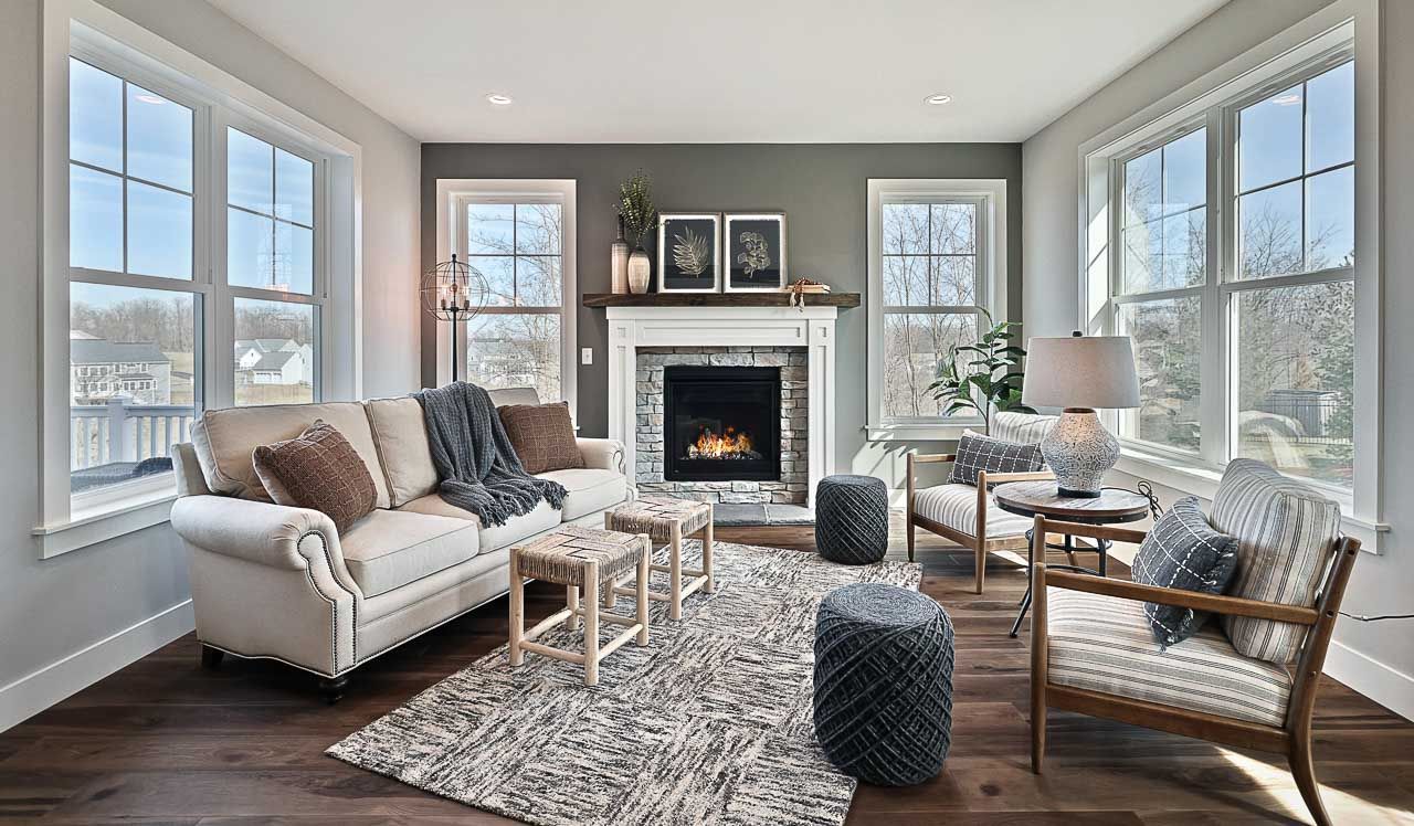 A living room filled with furniture and a fireplace.