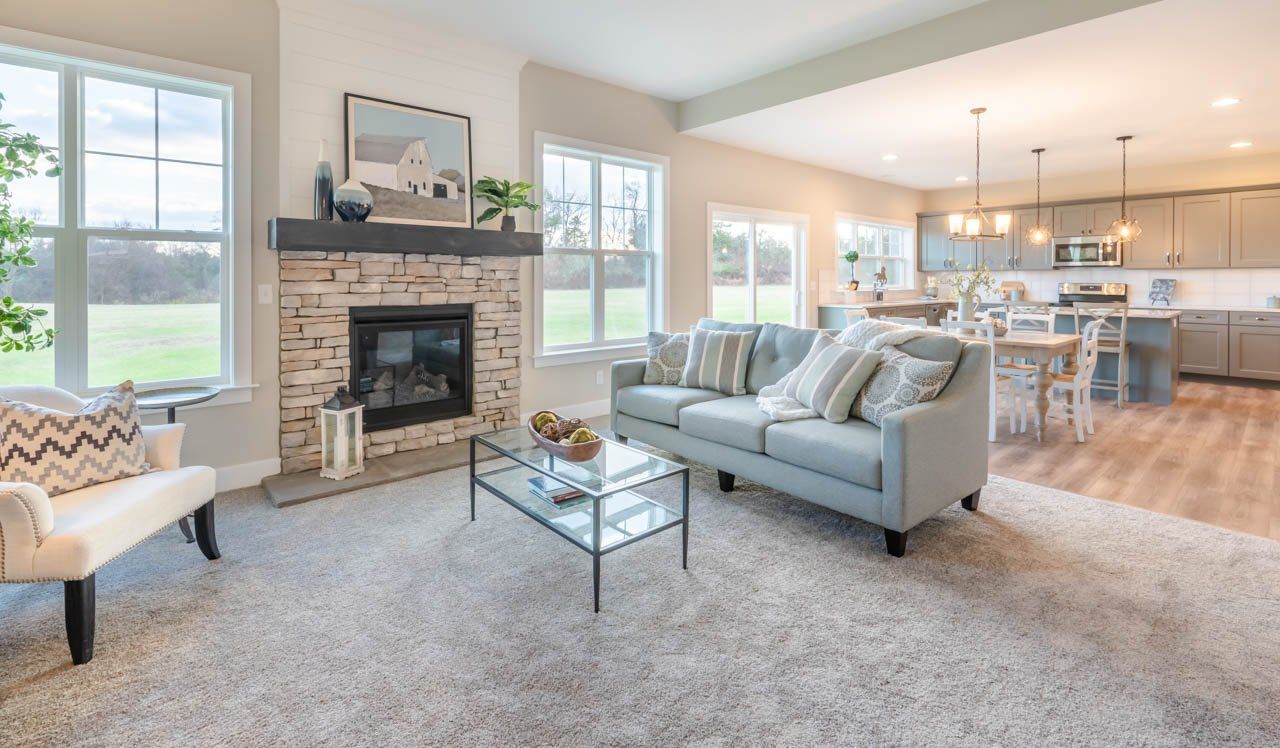 Stone fireplace featured in Kingston floor plan at Creekside Meadows