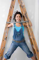 Woman Standing Between a Ladder — Jacksonville, NC — C & S Paint Center