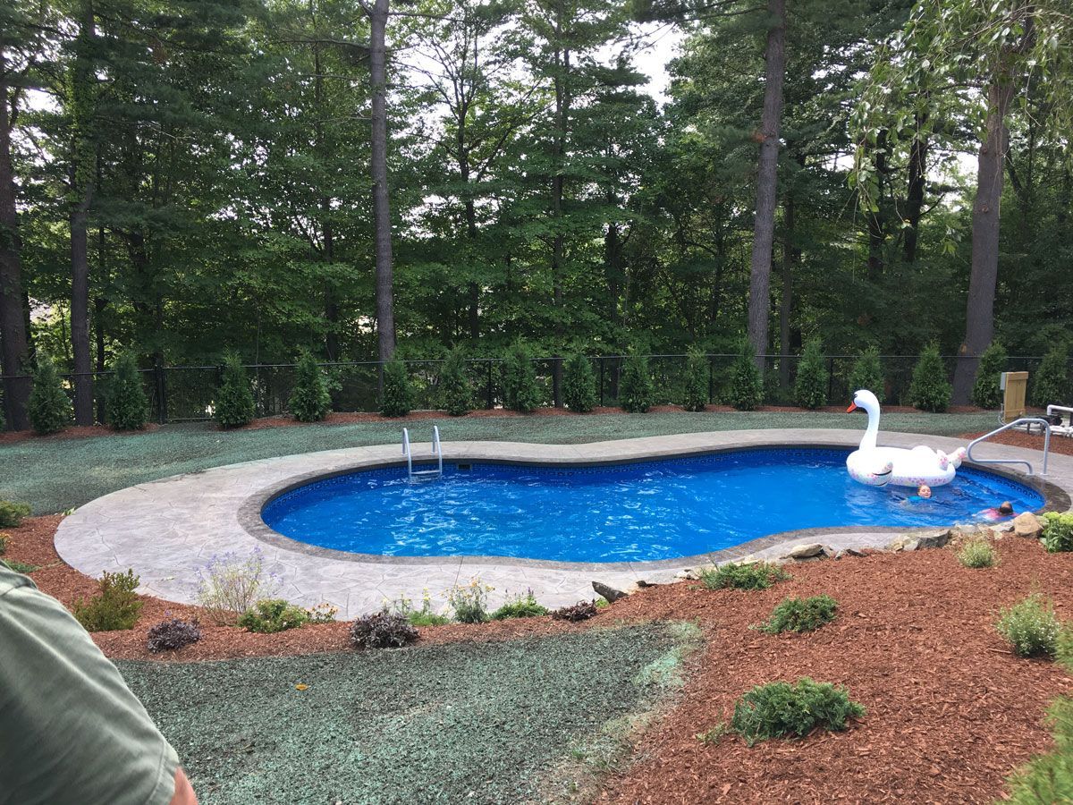 Swimming Pool With A Swan — Shrewsbury, MA — Maintenance Free Landscapes