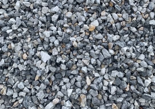 A pile of gravel is sitting on the ground.
