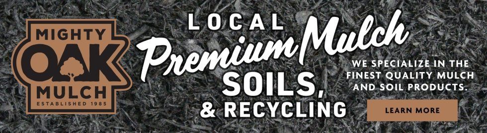 A sign that says local premium mulch soils and recycling