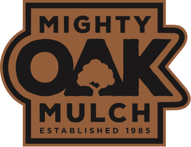 The logo for mighty oak mulch established in 1985