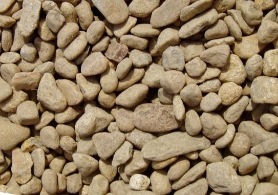 A pile of rocks with a smaller rock in the middle