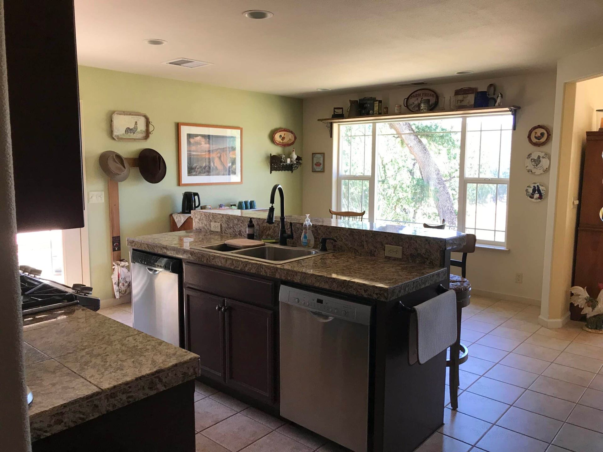 A kitchen with stainless steel appliances and granite counter tops