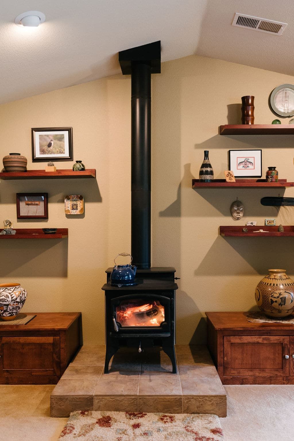 There is a wood stove in the middle of the room.