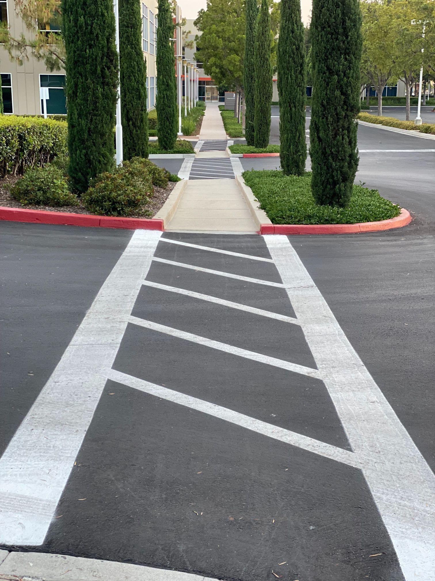 Rich, black asphalt with a faded painted yellow line.