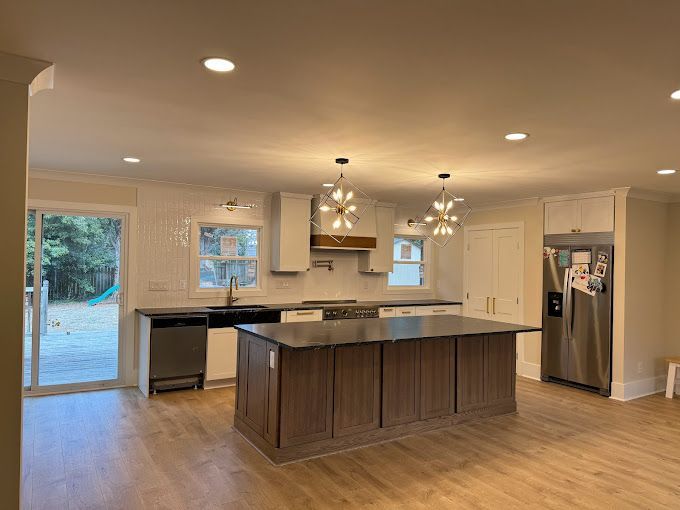 There is a large island in the middle of the kitchen.