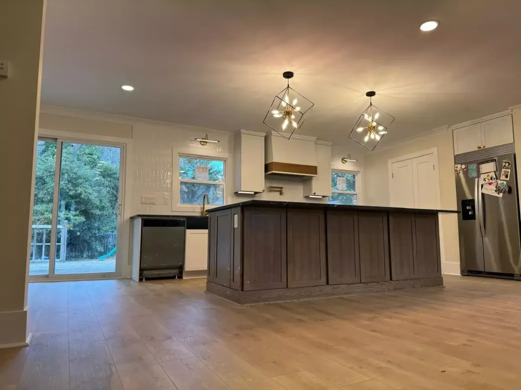 There is a large island in the middle of the kitchen.