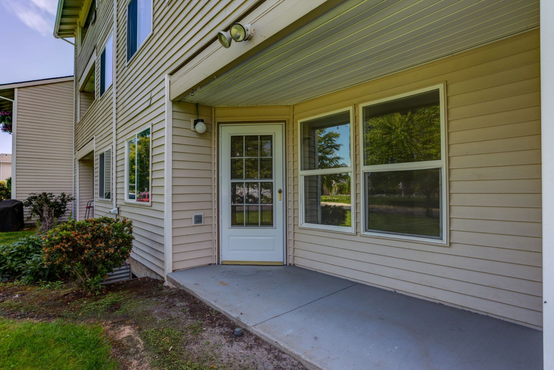 A house with a porch and a white door.