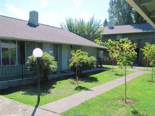 A row of houses with a walkway between them