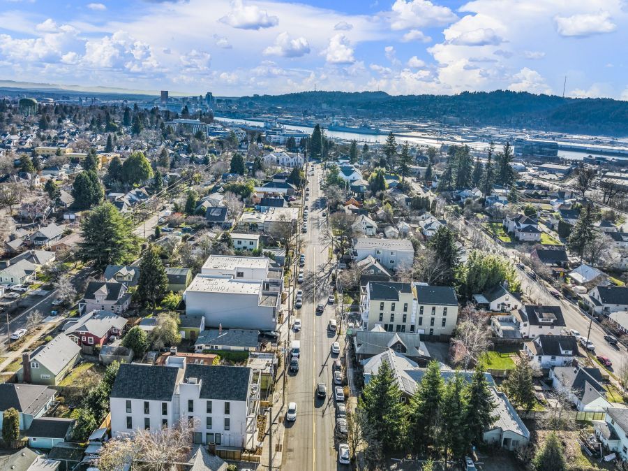 An aerial view of a city with a lot of houses and trees.