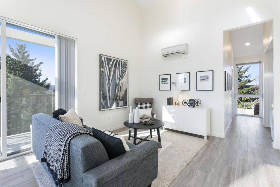A living room with a couch , chair and table