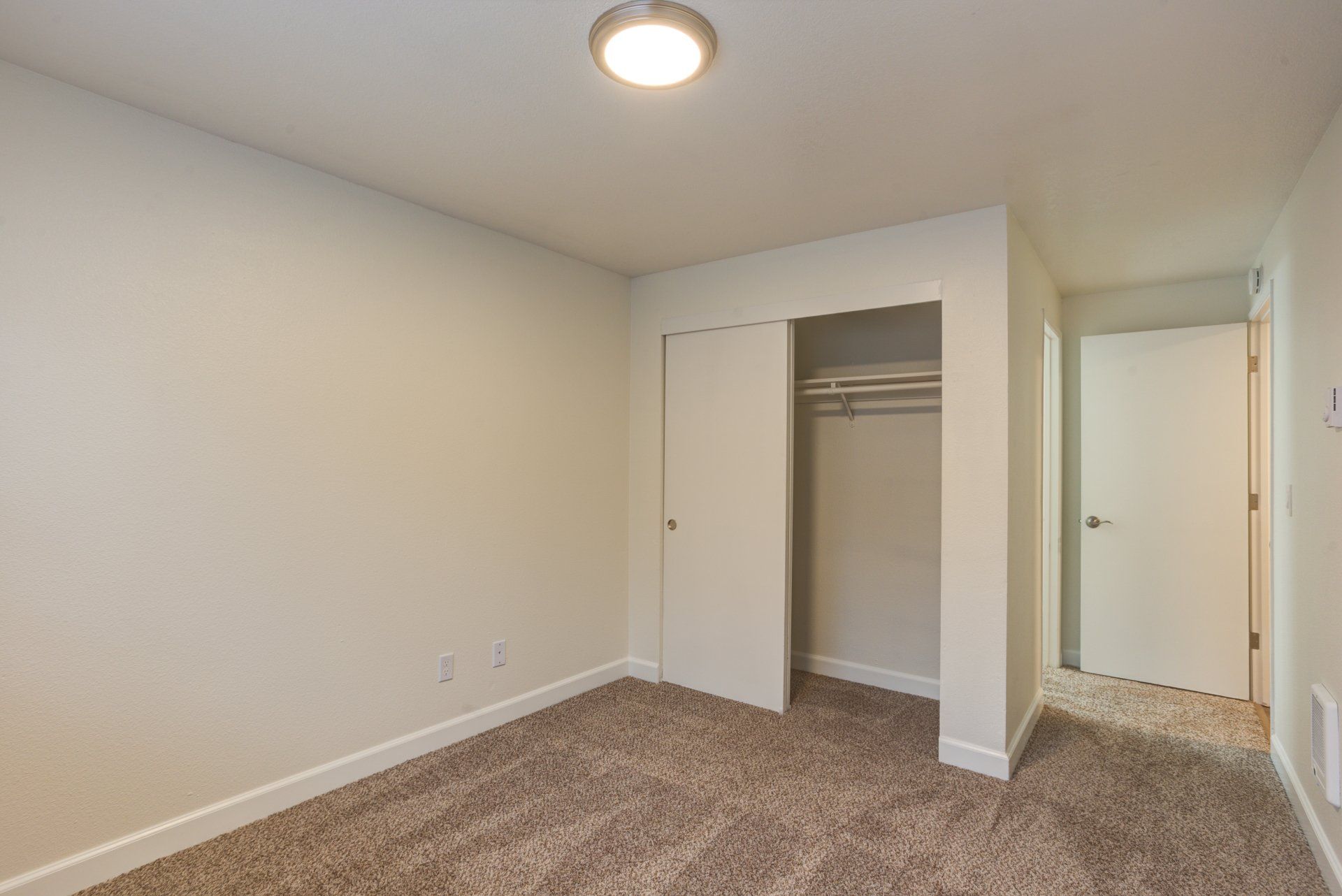 There is a closet in the middle of the room.