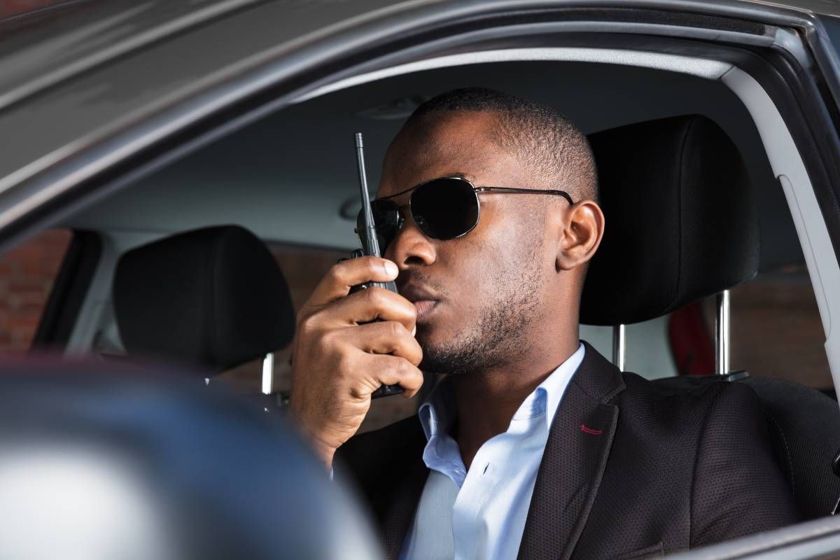 A private security professional talking on a walkie-talkie near Lexington, KY