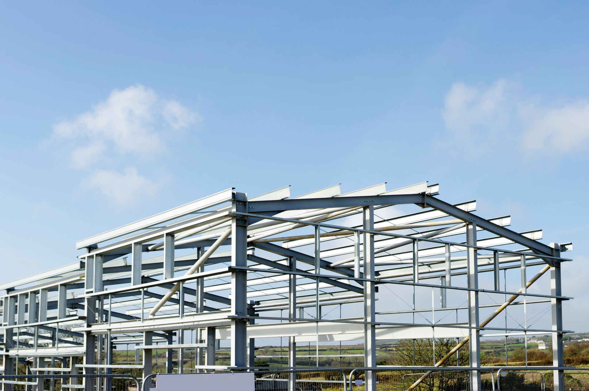A large metal structure with a blue sky in the background.