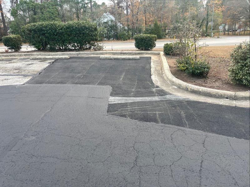 Cracks And Patches On Asphalt Road