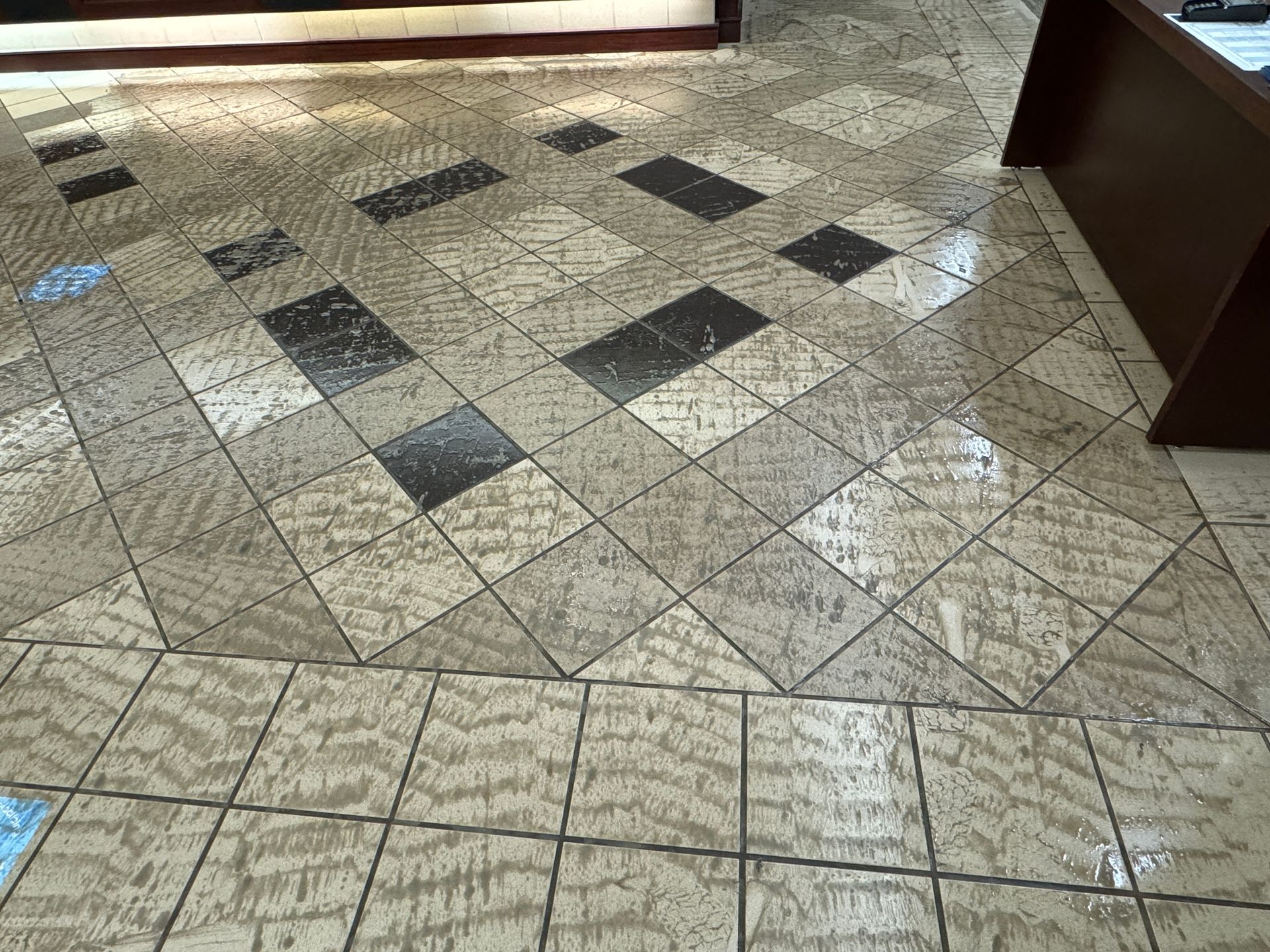 A laundry room with a washer and dryer , sink , and shelves.