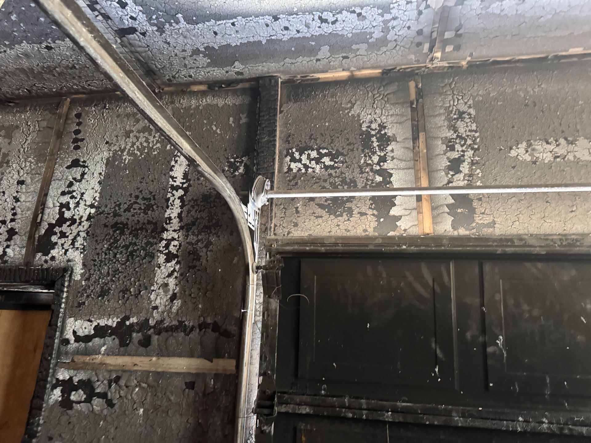 Interior view of a fire-damaged garage. 