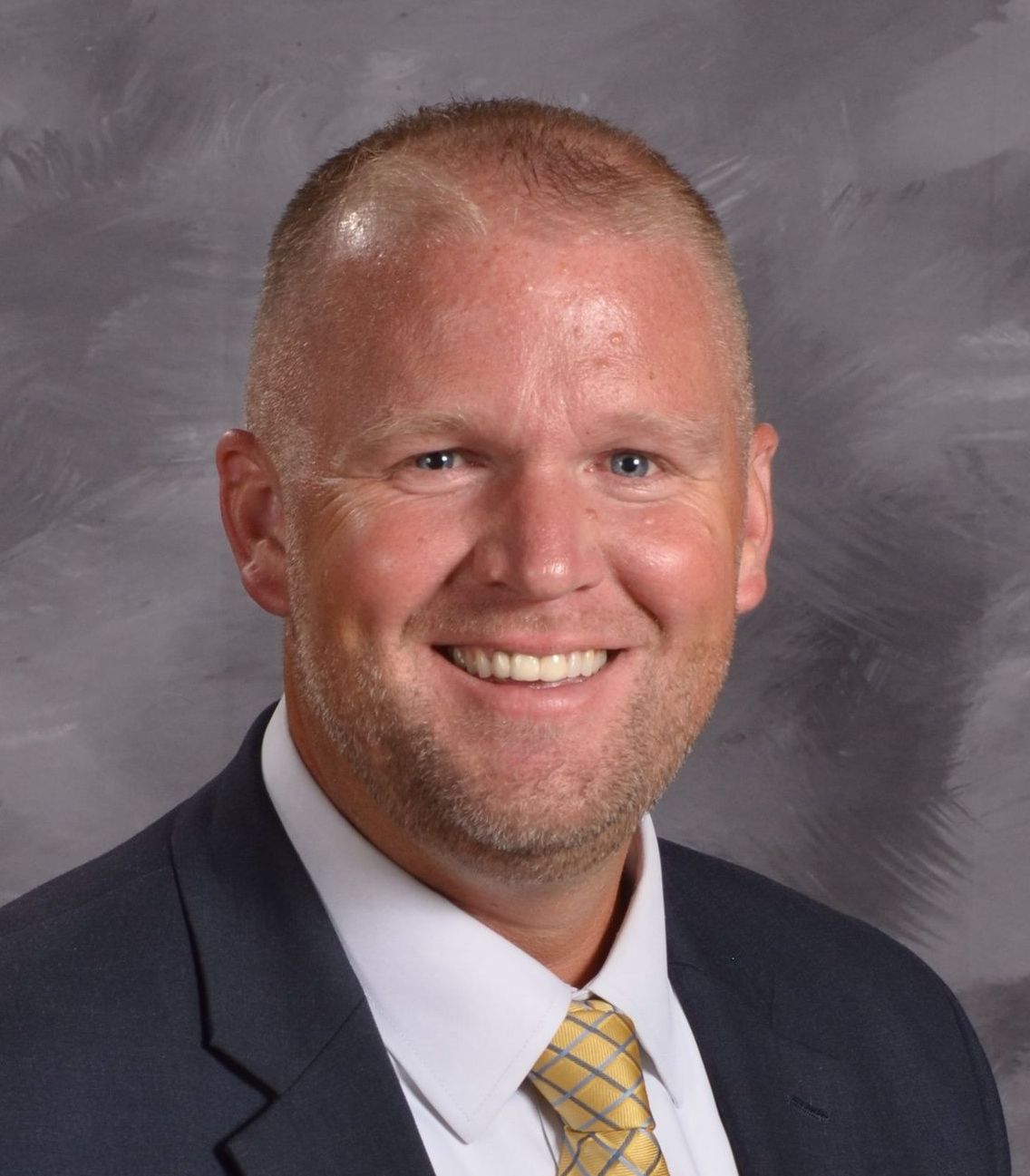 Smiling head shot of Jeffrey J Loberger