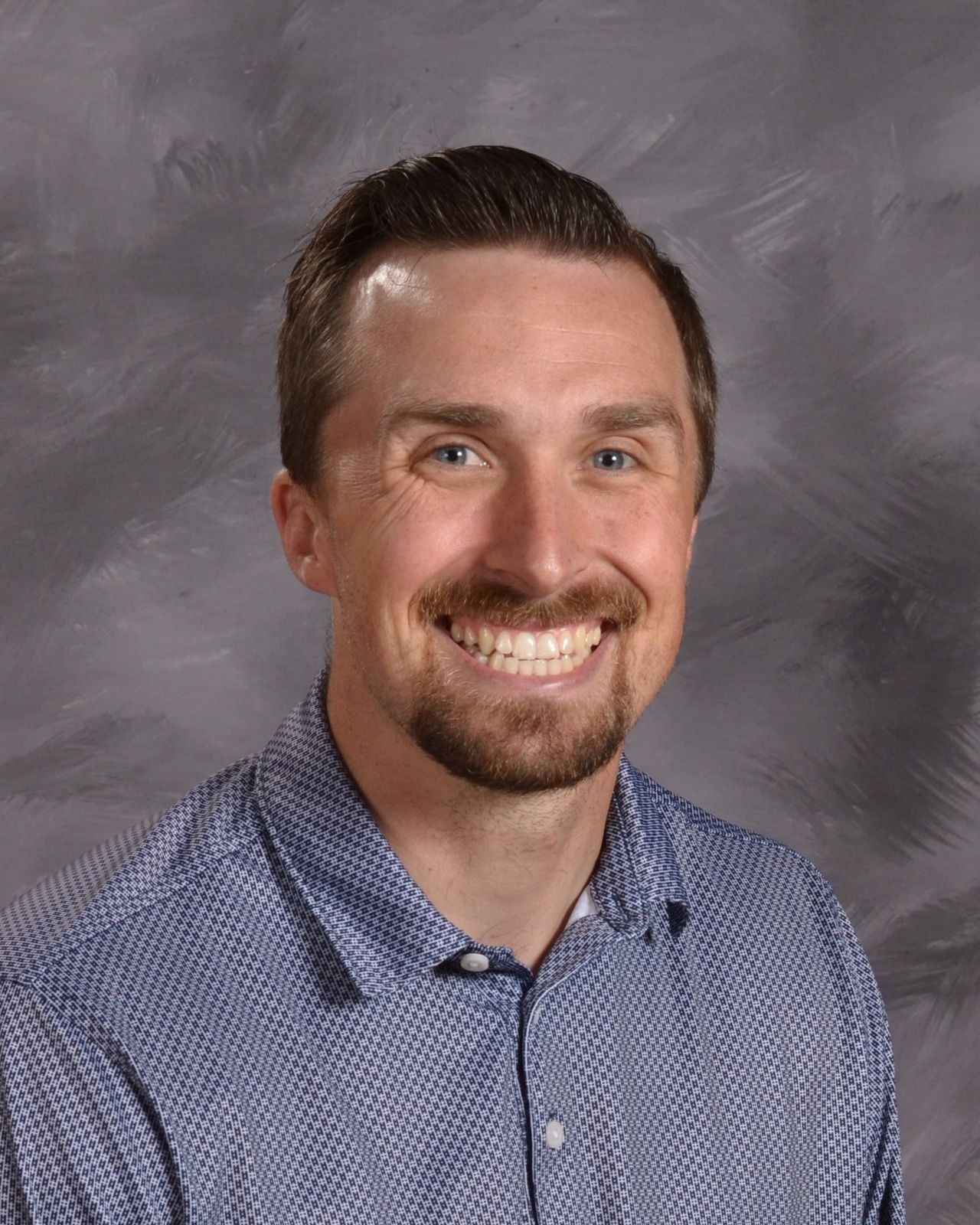 Smiling head shot of Jason Malkowski