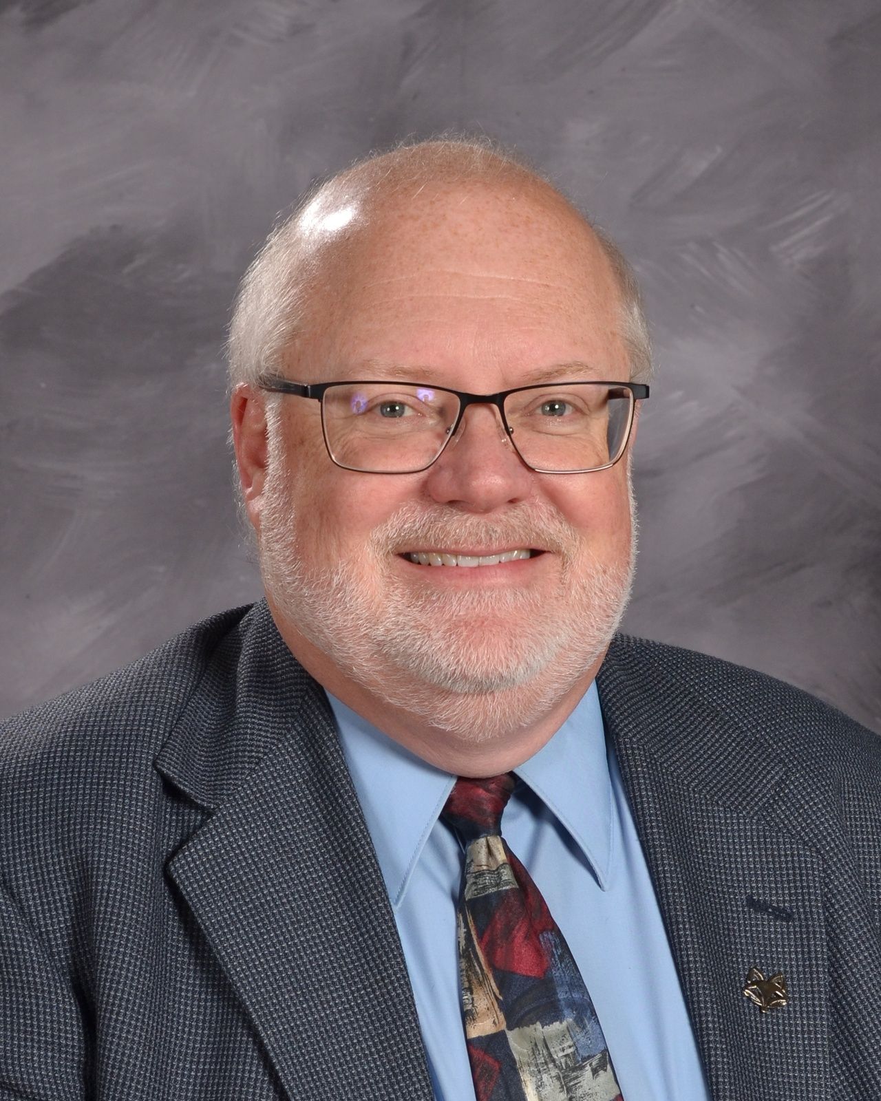 Smiling head shot of Rev. Tom Mielke