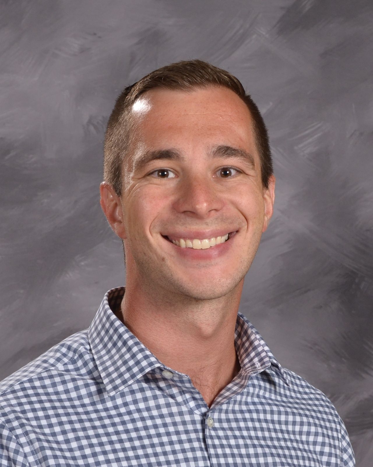 Smiling head shot of Colin Paustian