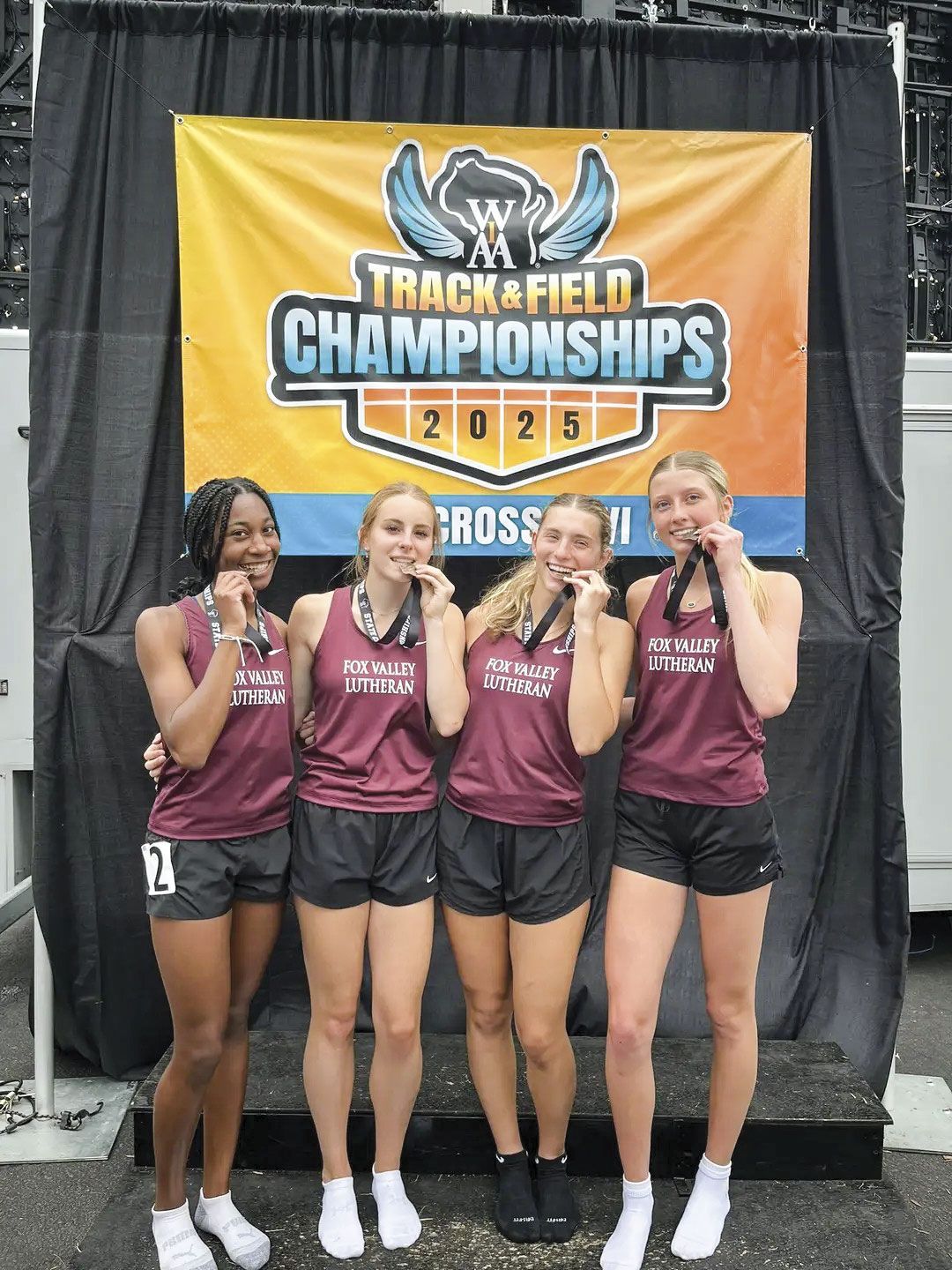 Four track girls on the podium - received 6th place at state
