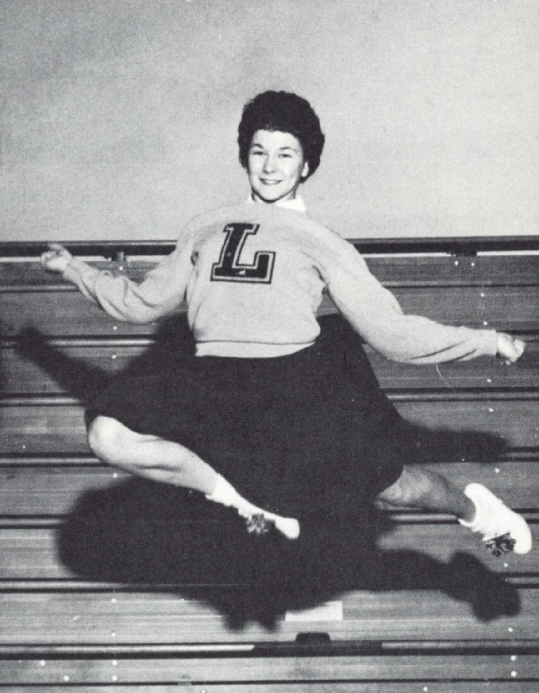 Cheerleader in the air, wearing her