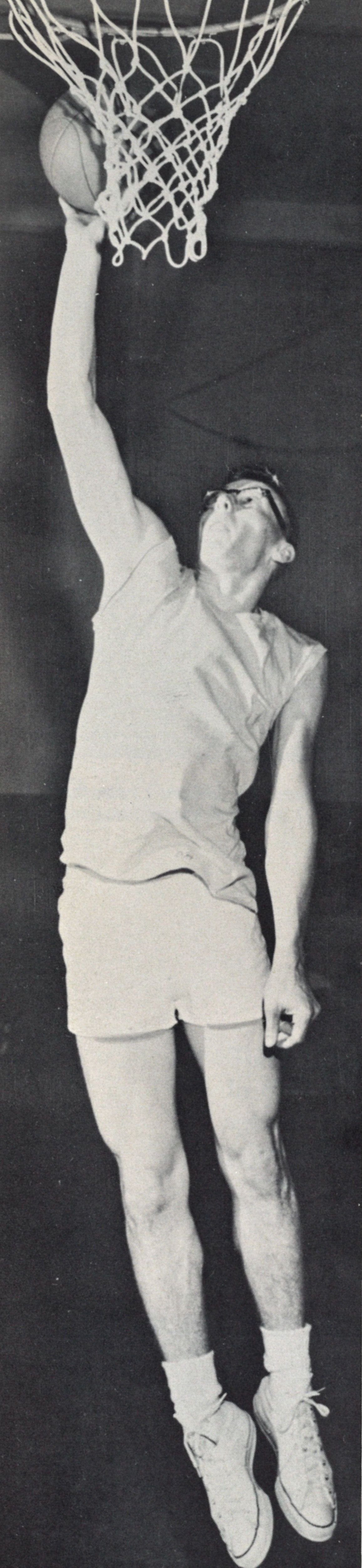 Male student shooting a basket