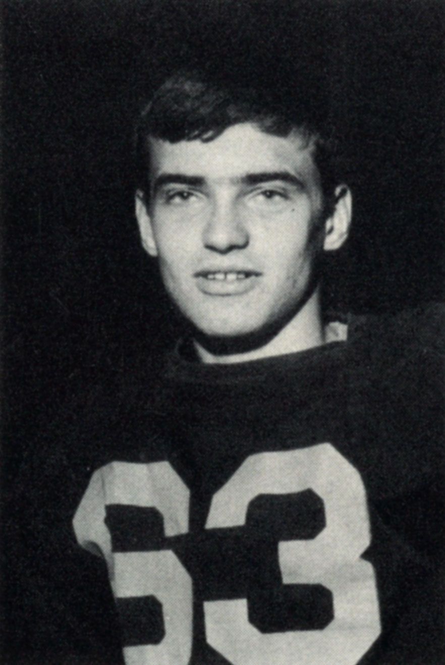 Football player (#63) looking at the camera (no helmet)