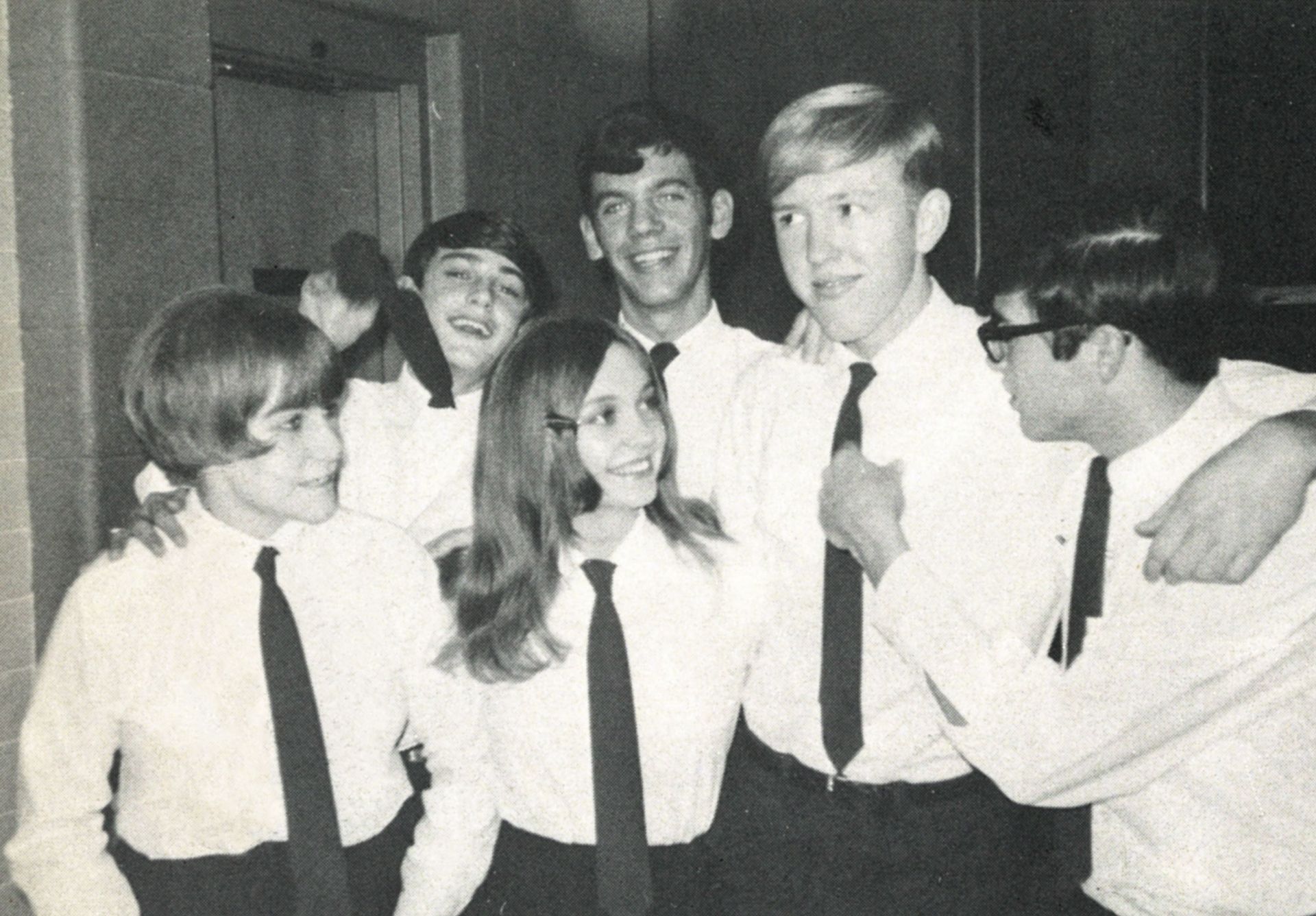 Four guys and two girls in white shirts and ties