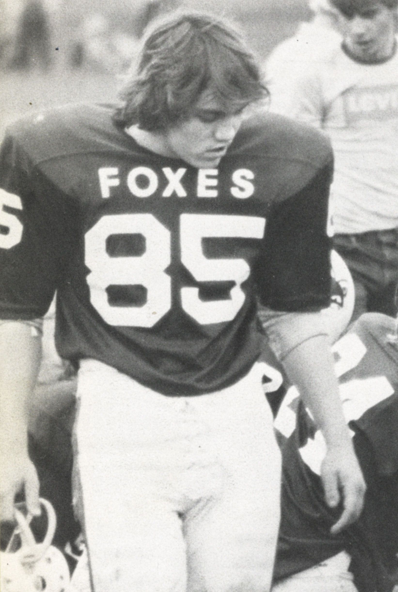 Team member walking without helmet