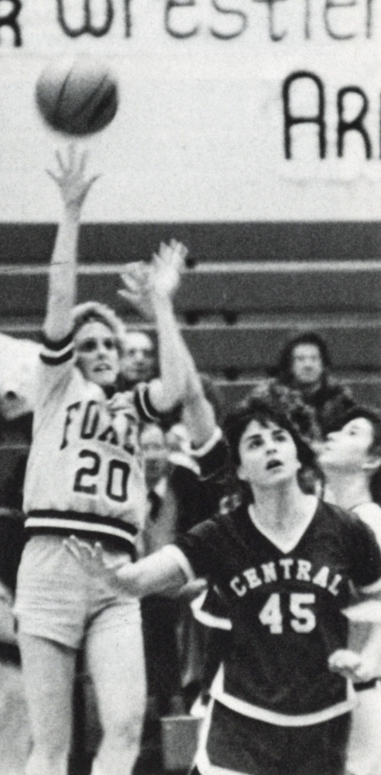 Girls basketball team member jumping - looks like she just shot for a basket 