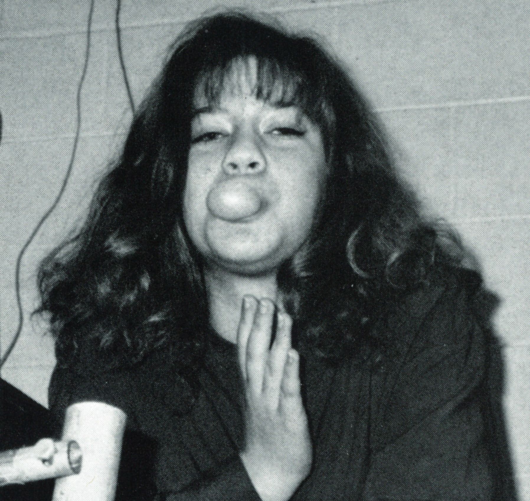 Girl blowing a bubble with bubble gum