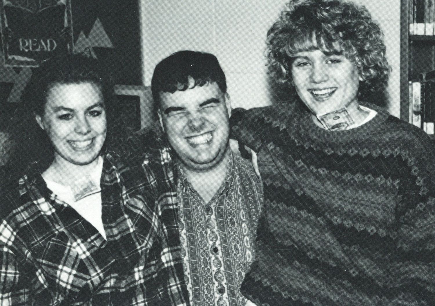 Laughing guy and two smiling girls