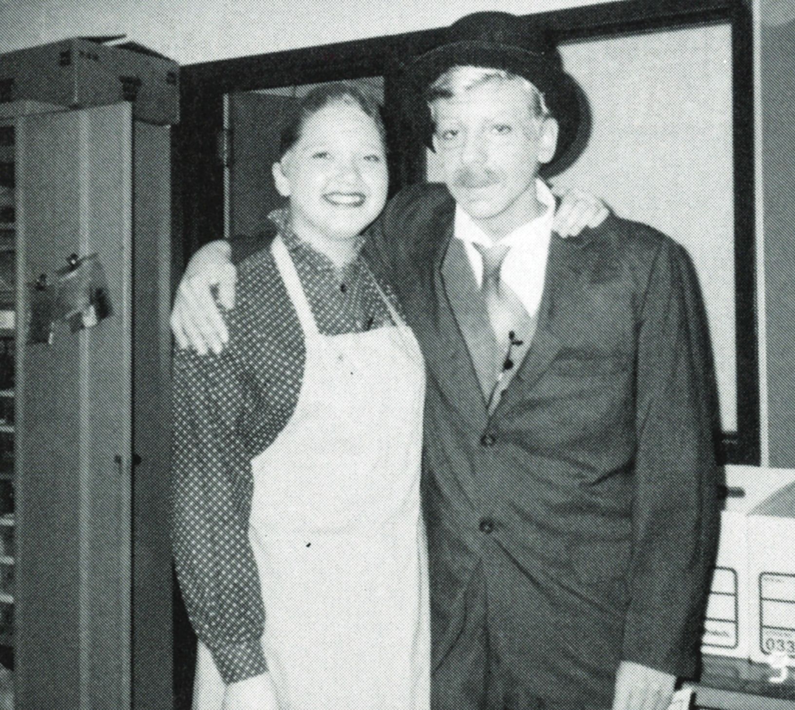 Smiling male and female theatre students in costume