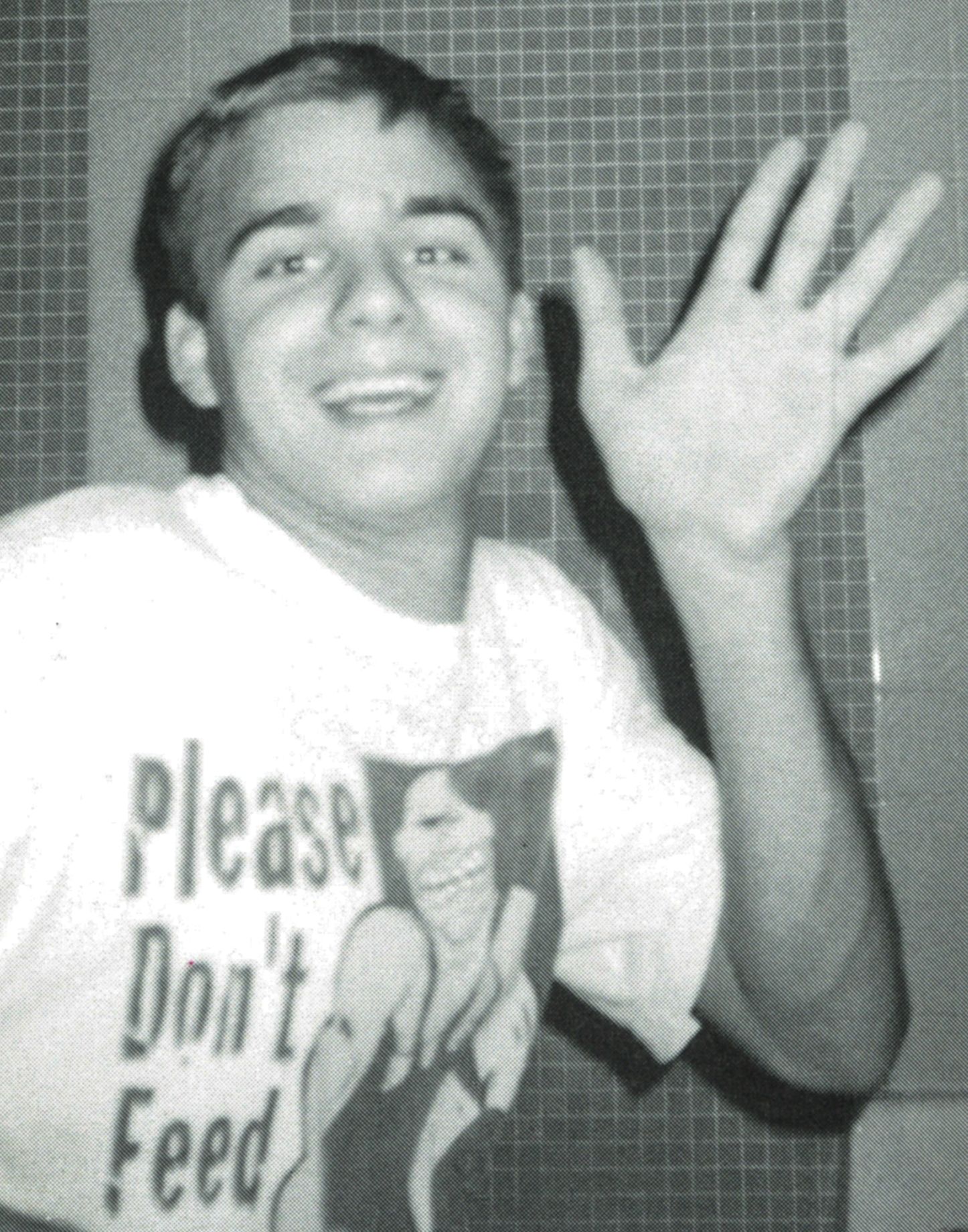 Smiling boy waving to the camera