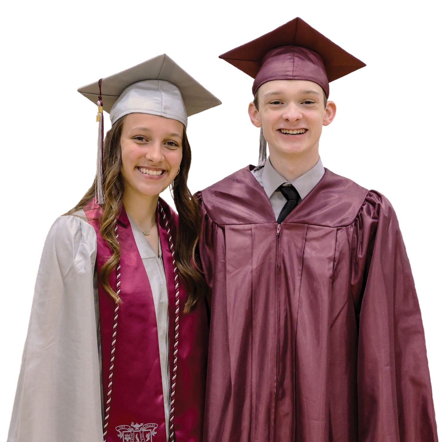 Smiling girl and boy graduates