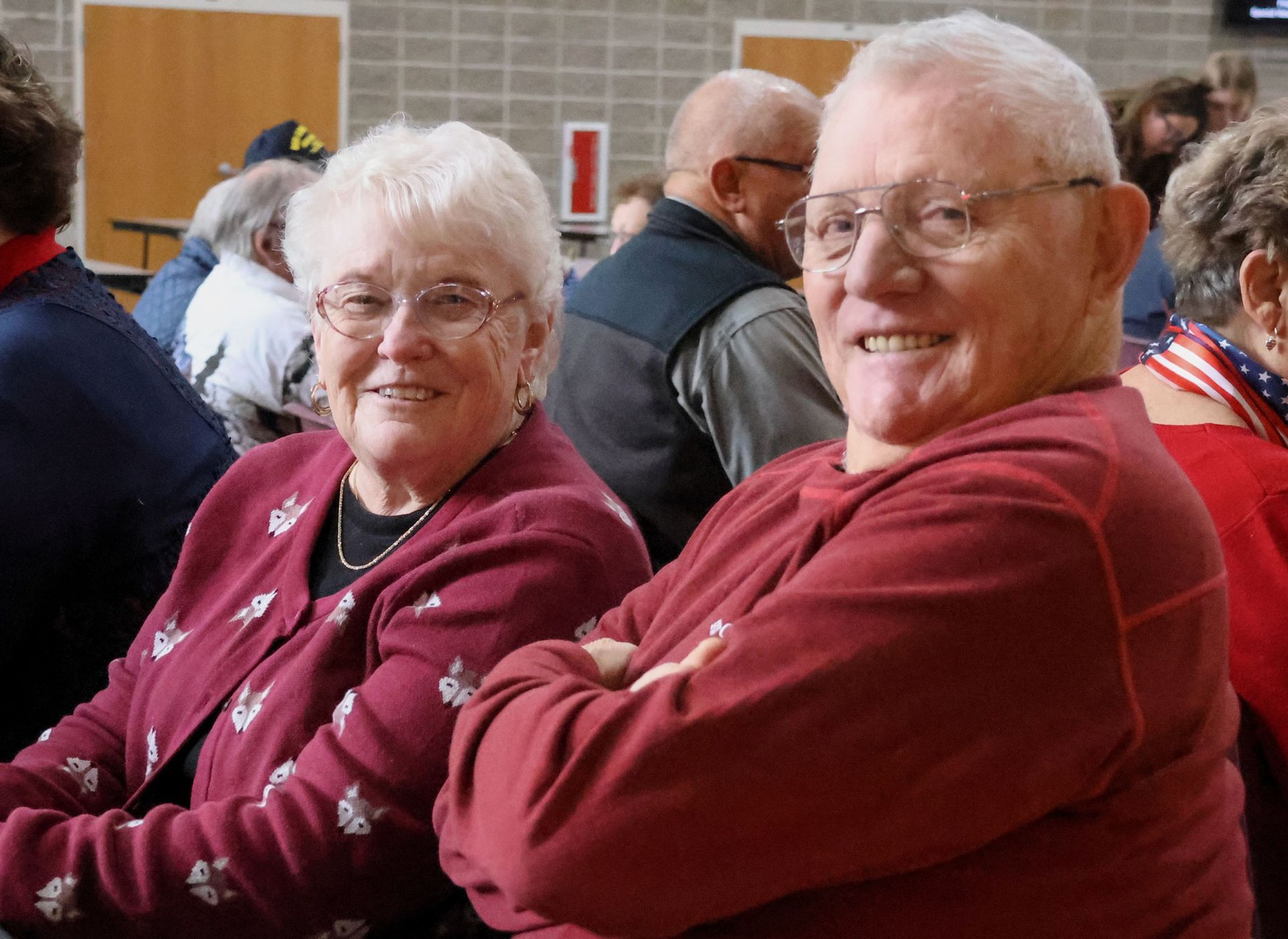 Smiling couple, sitting at a table during the breakfast portion of the event