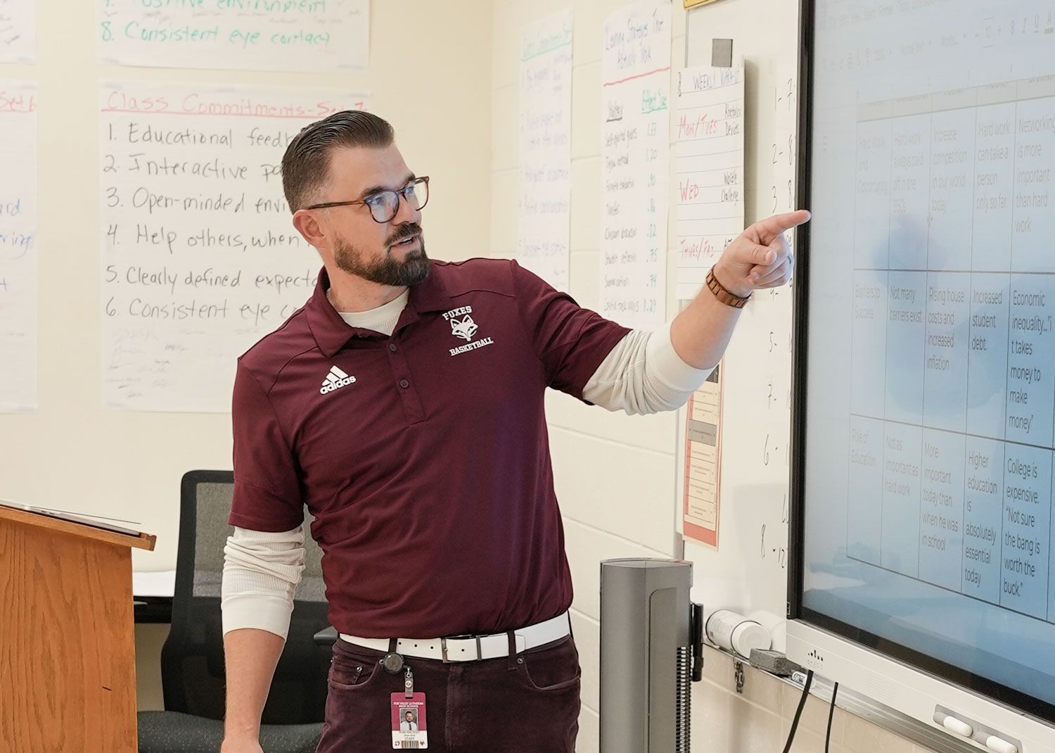 Ryan Kirchoff pointing to smart board