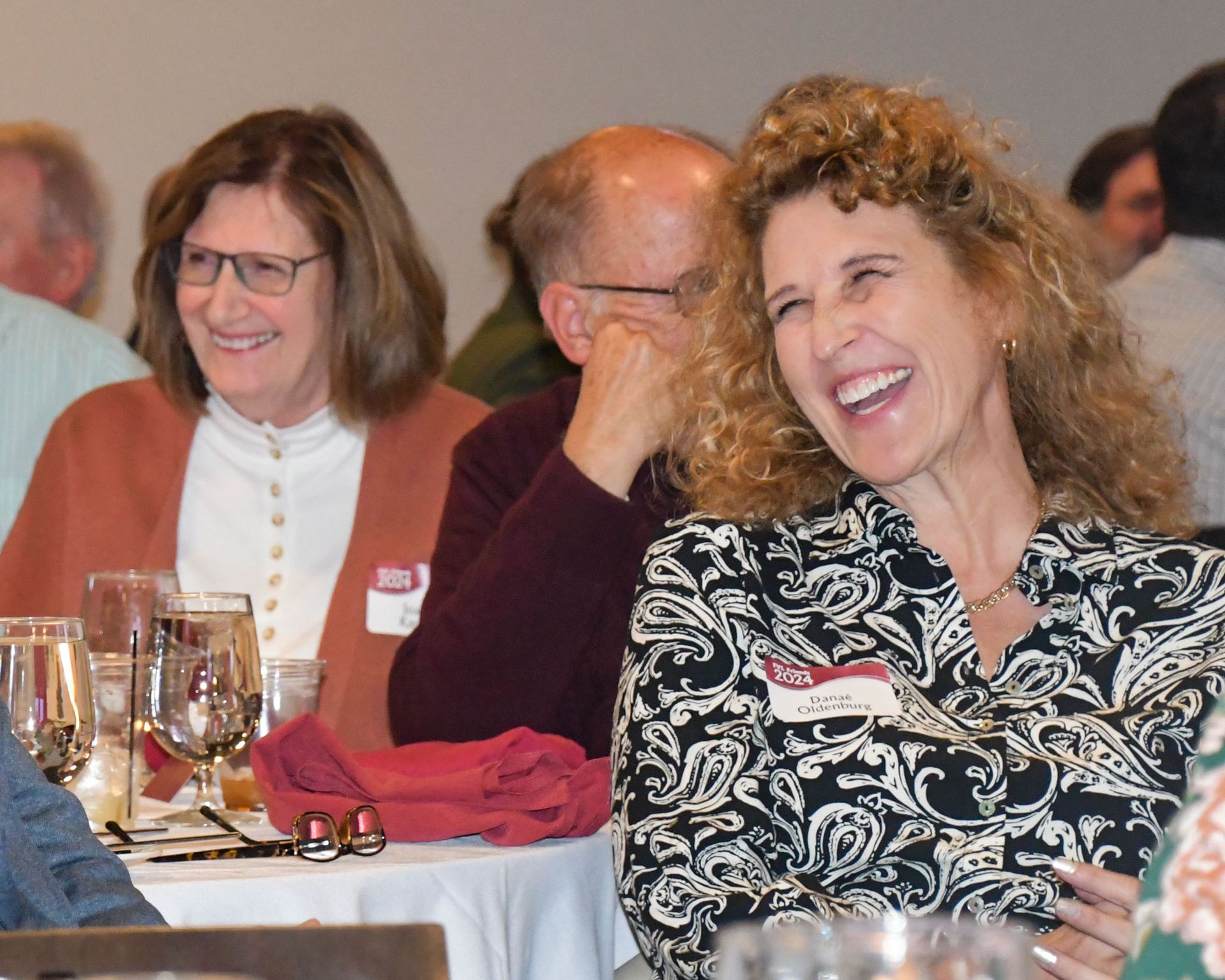 A smiling couple, standing