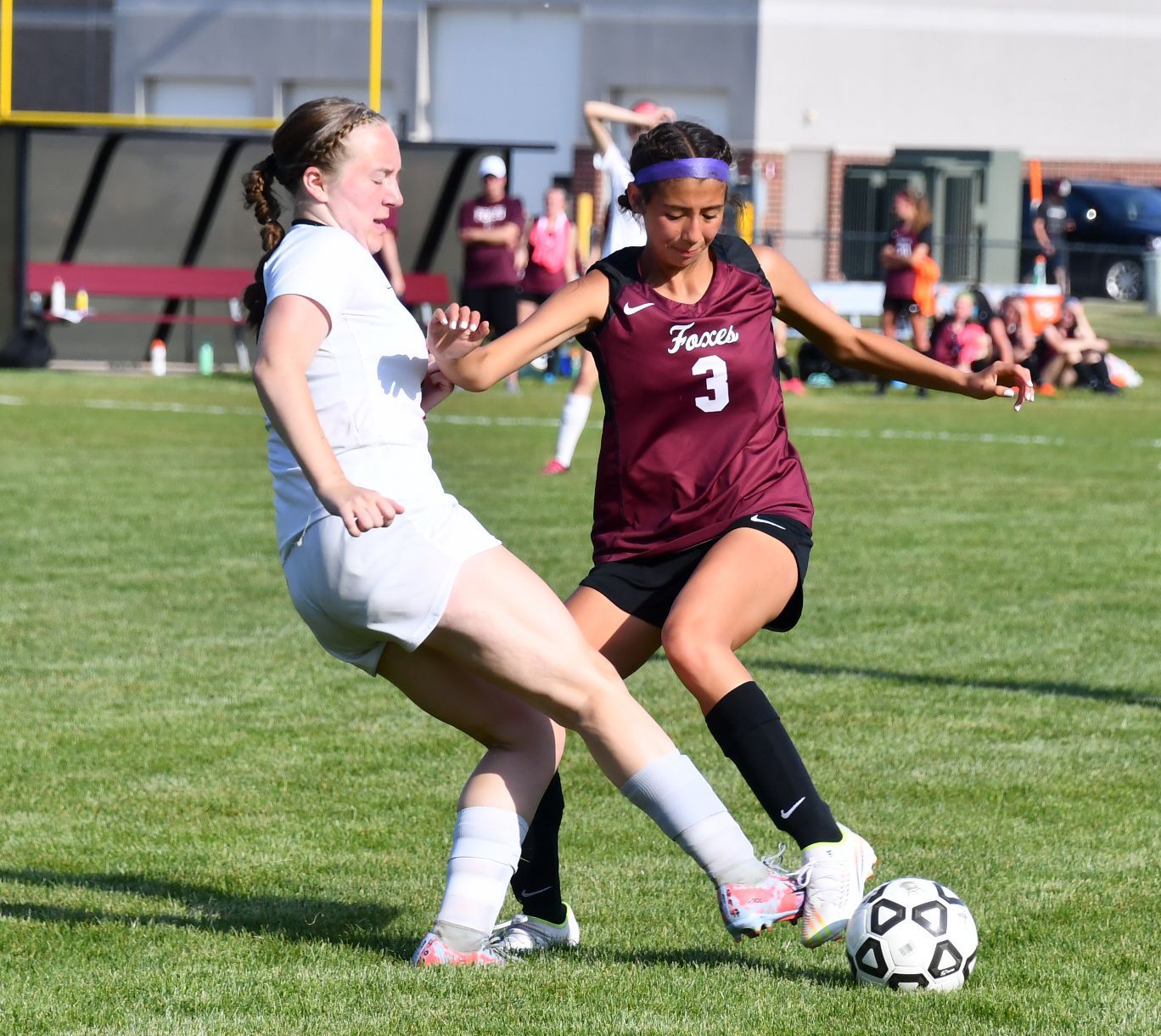 Brielle, keeping a ball away from an opponent
