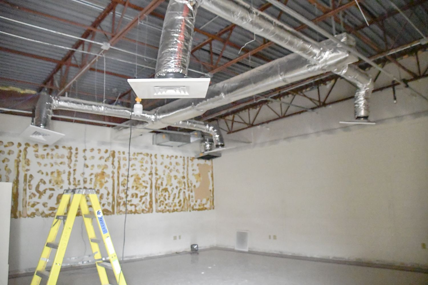 Former classroom (new Communications Suite), stripped of furnishings and ceiling in prep for construction