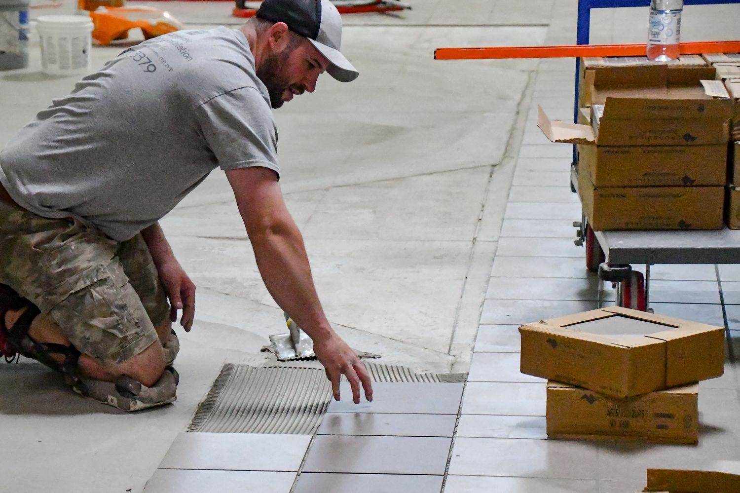 Tile is being laid on the concrete