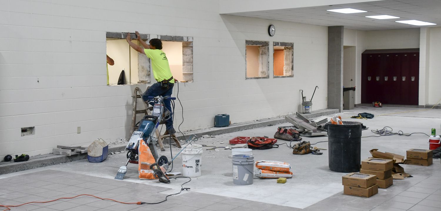 Work being done on the pit-area window removal and bricking prep