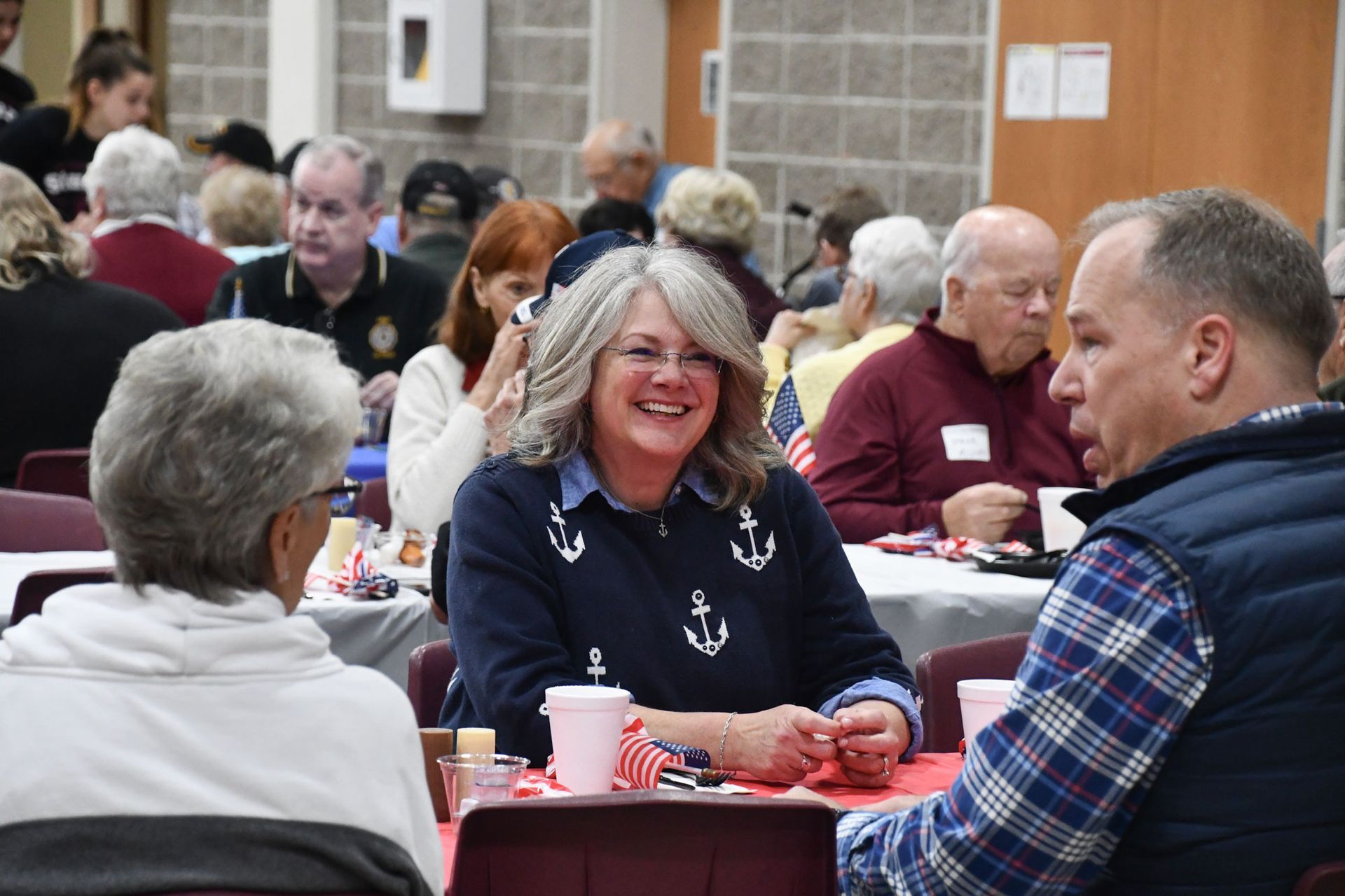 Happy couple at a table during the Veterans Day breakfast