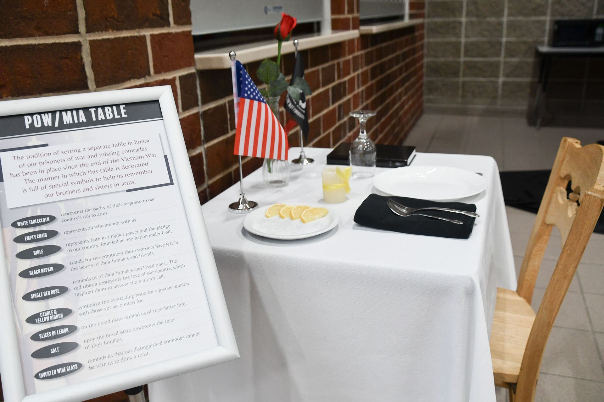 Smiling couple, sitting at a table during the breakfast portion of the event