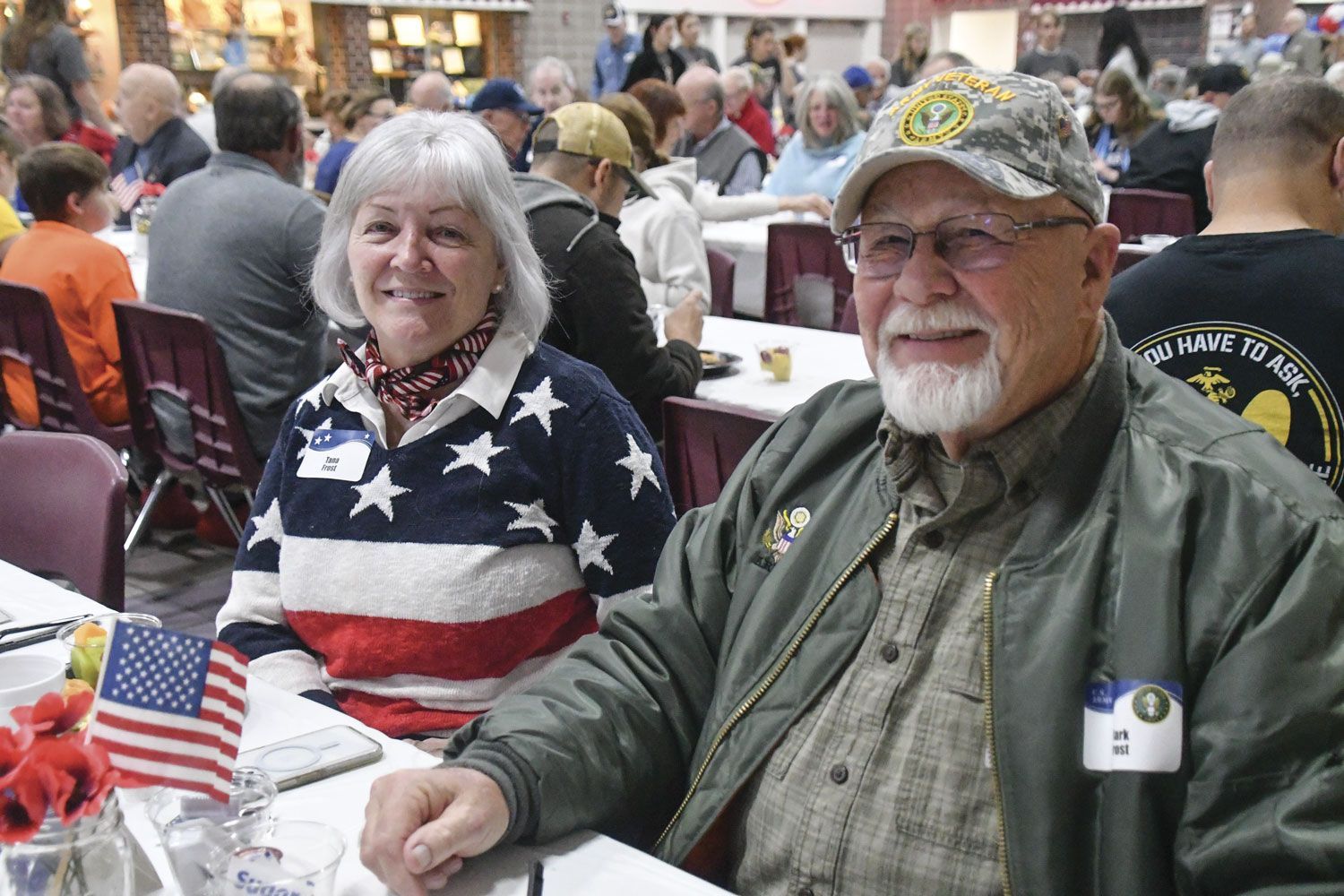 Happy couple at a table during the Veterans Day breakfast